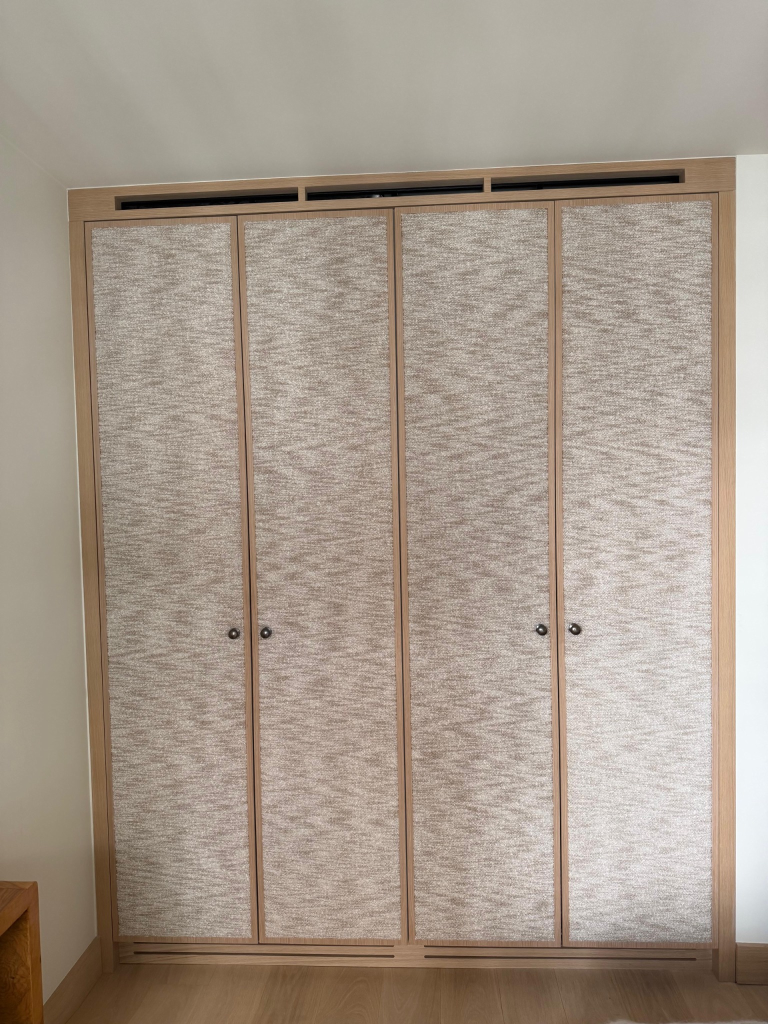 Textured full-height wardrobe doors in timber frames