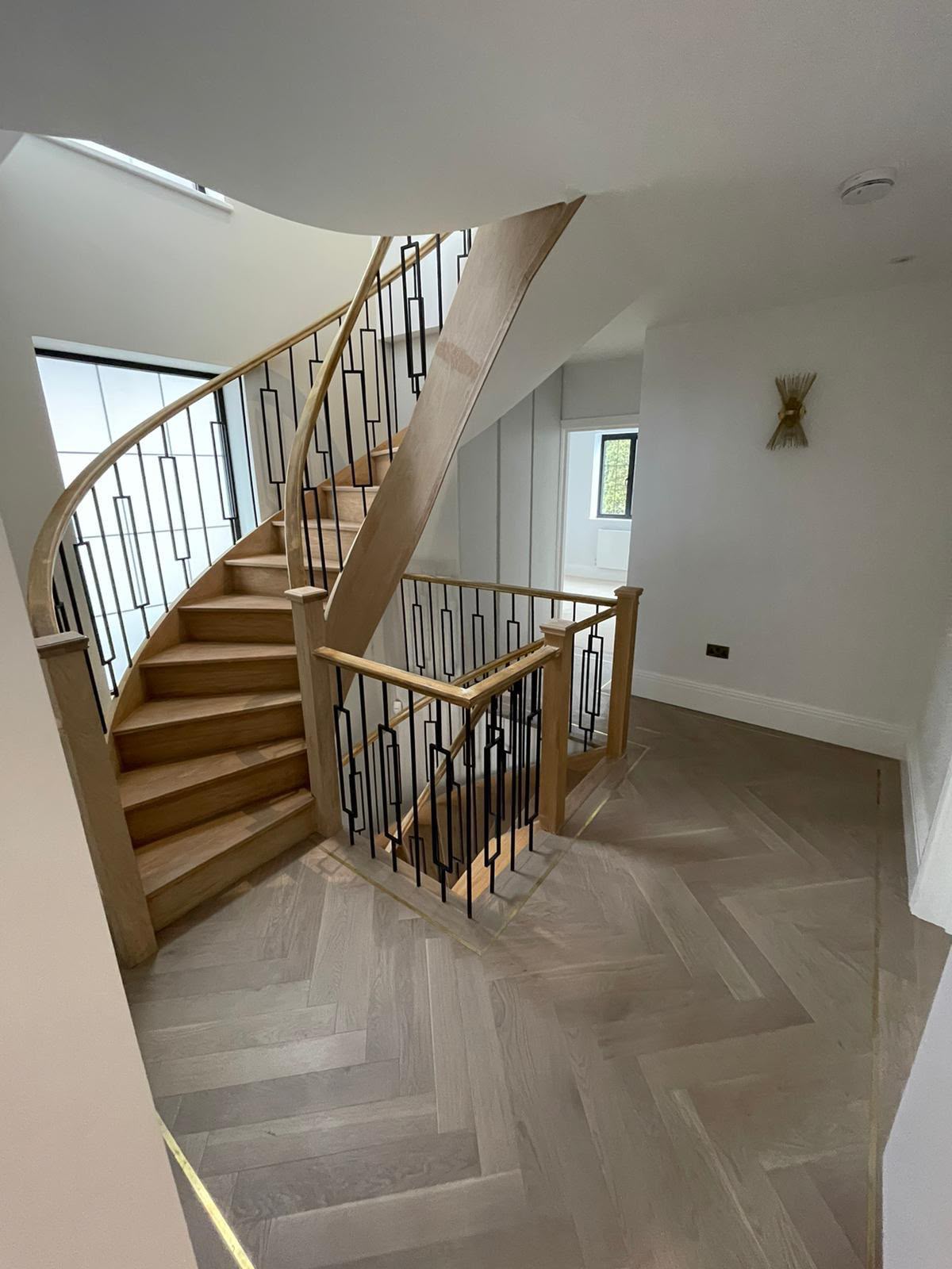 Timber staircase and matching balustrade around an upper landing