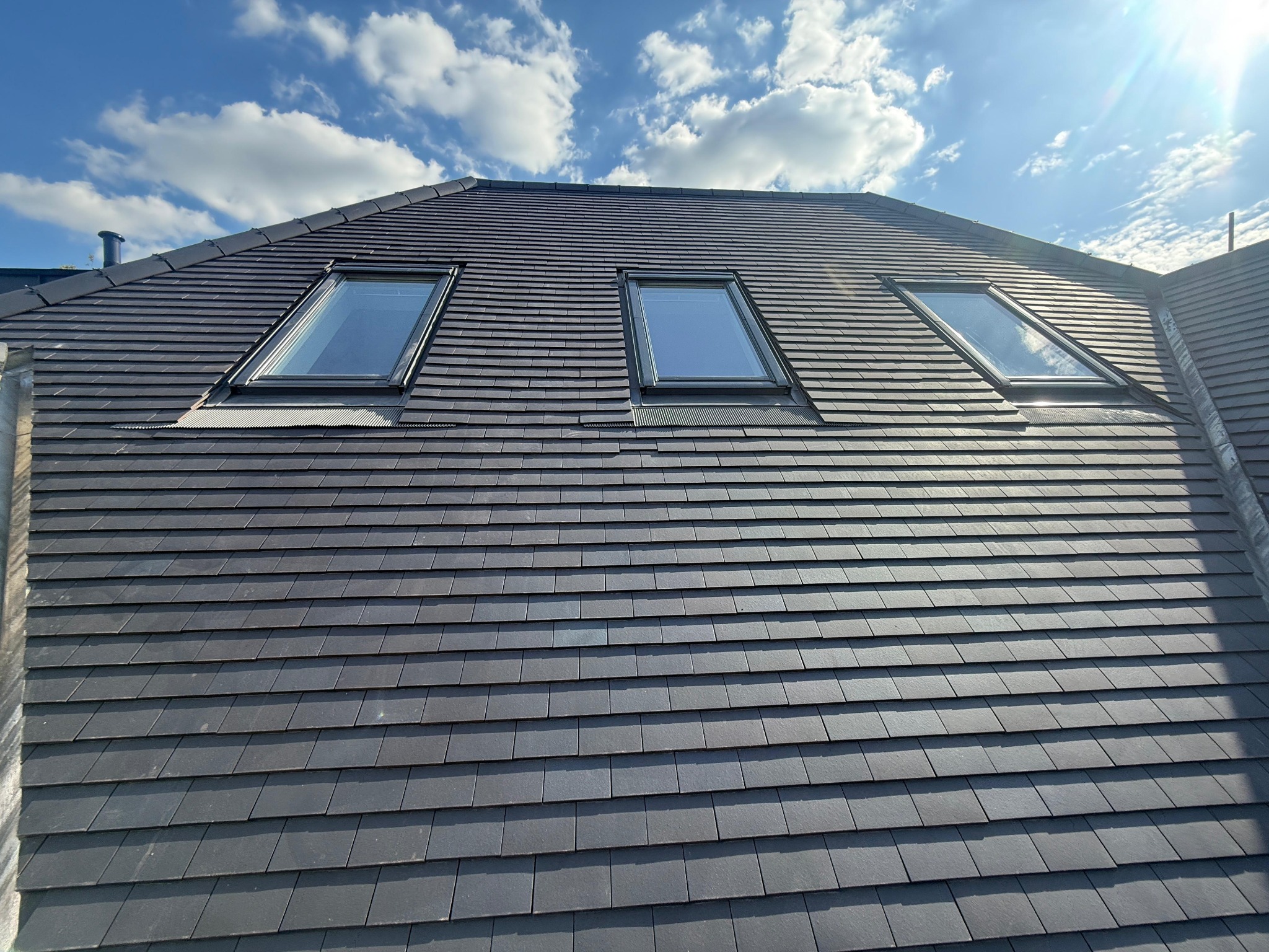 Tiled pitched roof with three inset rooflights