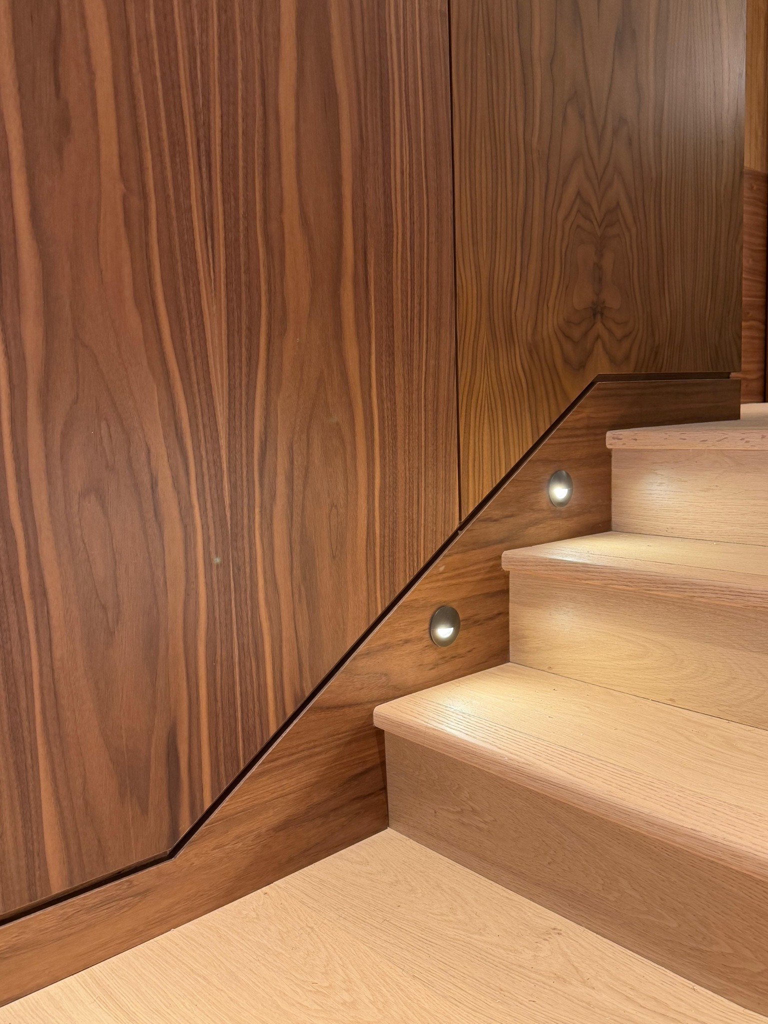 Timber staircase beside matching wall panels